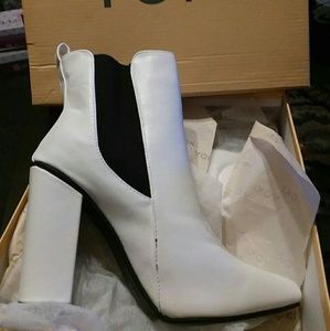 Brand new heeled white boots